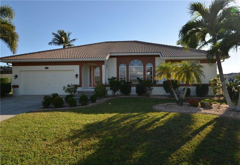 PGI! CHARMING 3/2/2 ON OVERSIZED LOT WITH SAILBOAT