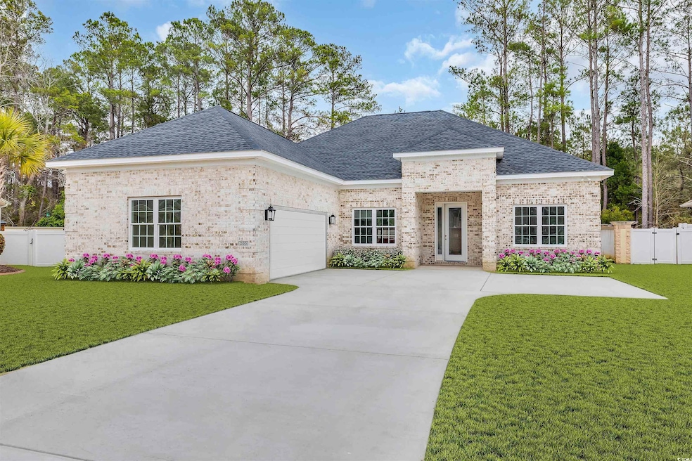 View of front facade featuring a garage and a fron