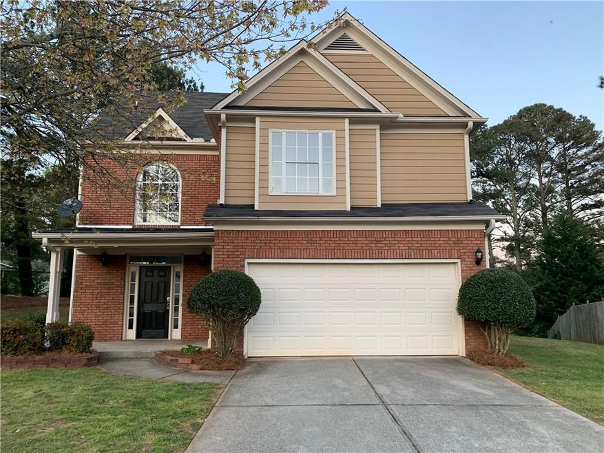 View of front of home featuring a garage and a fro