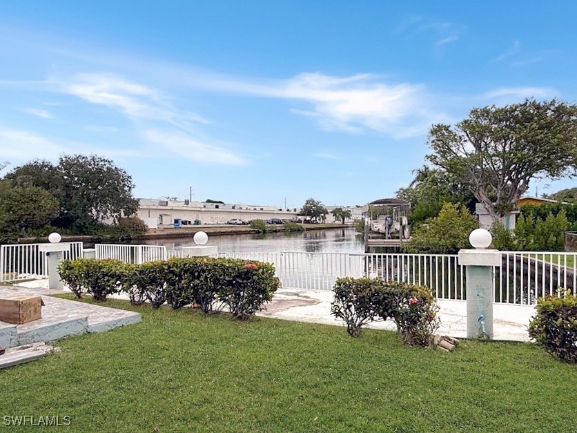 View of yard with a patio area and a water view