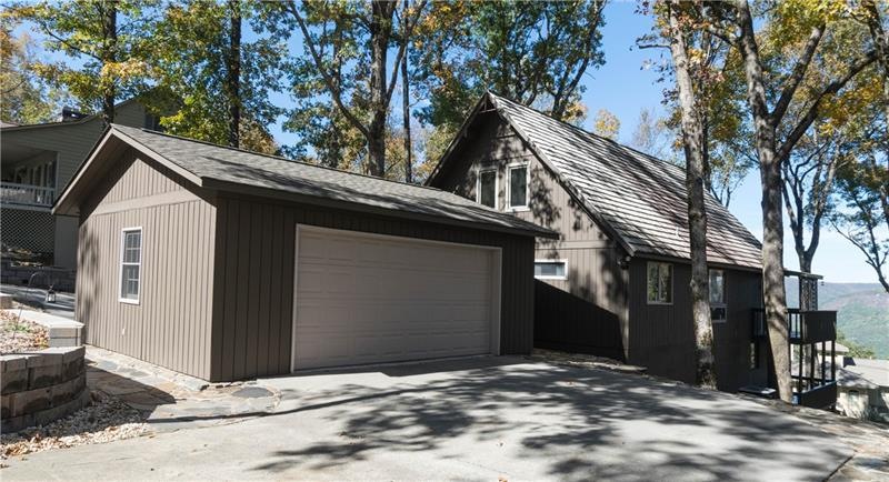 Circular drive goes through garage with double doors