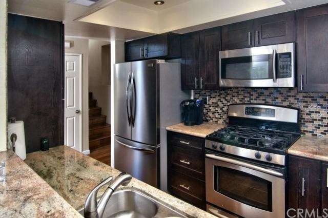 Remodeled kitchen includes side by side stainless 