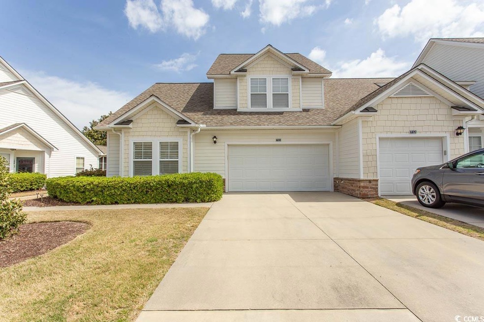 View of front of property with a shingled roof, co