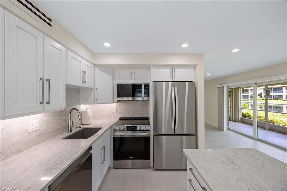 1155 Sandpiper St unit F7, Naples, FL 34102 - photo 1