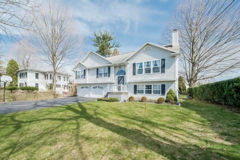 Picture perfect raised ranch in the heart of Trumb