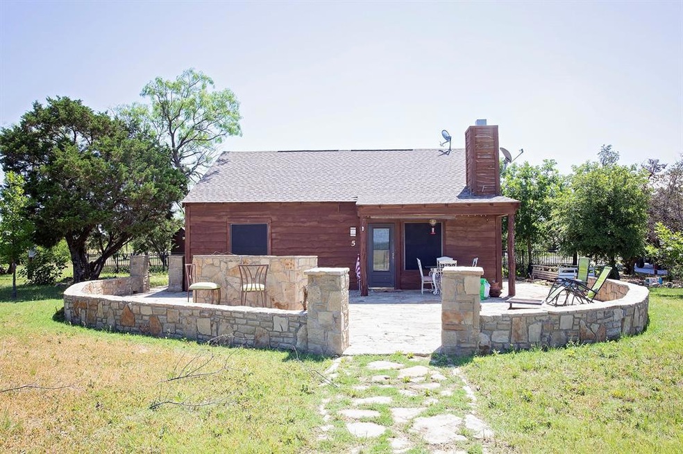 Custom stone patio with built in grill. This is a 