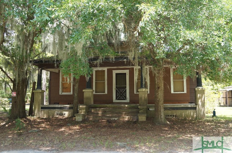 Expansive front porch overlooks yard w/beautiful s