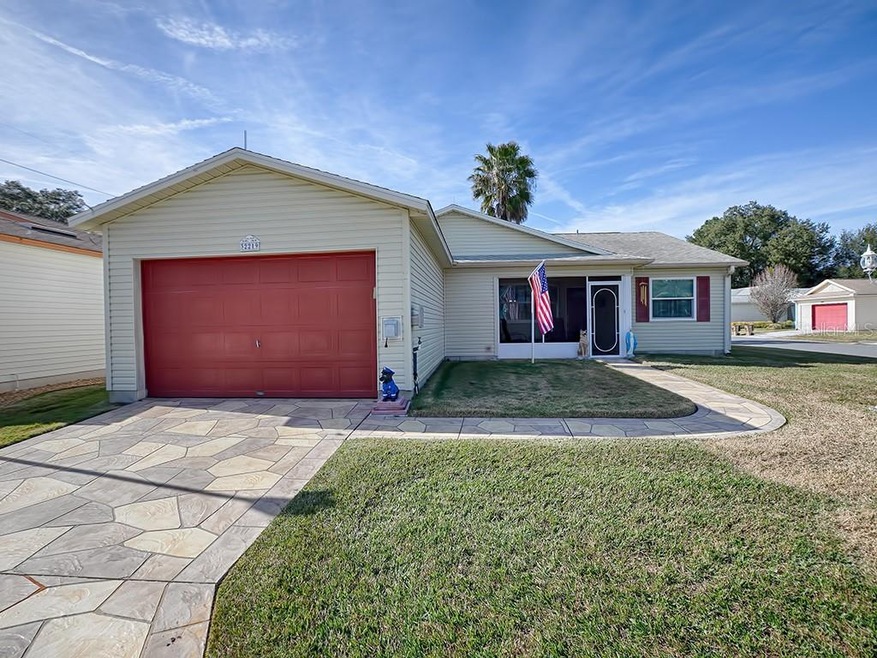 WOW!  LOOK AT THAT STAMPED CONCRETE DRIVEWAY AND GORGEOUS RED GARAGE DOOR!