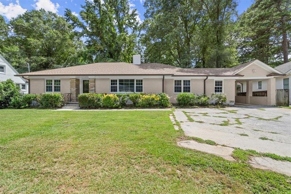 Ranch-style home featuring a front yard
