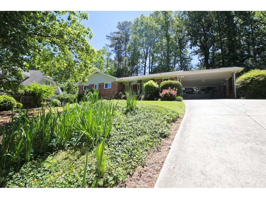 Green landscaping makes the front yard a sunny wel