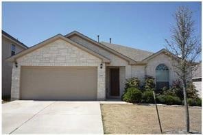 View of front of home featuring a garage and driveway