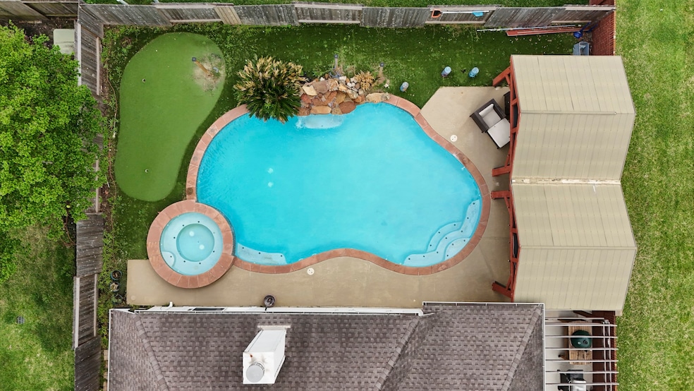 A stunning aerial view of your new home and backya