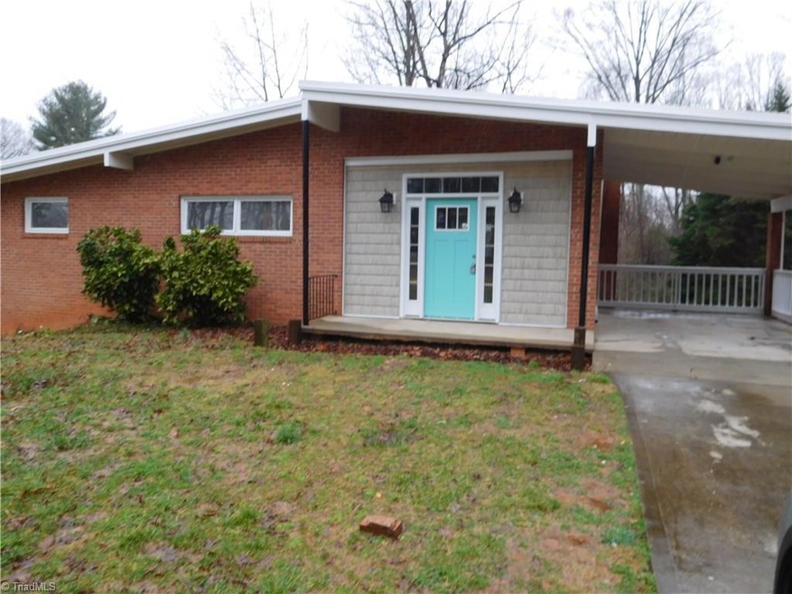 Modern Style Ranch home w/attached carport.