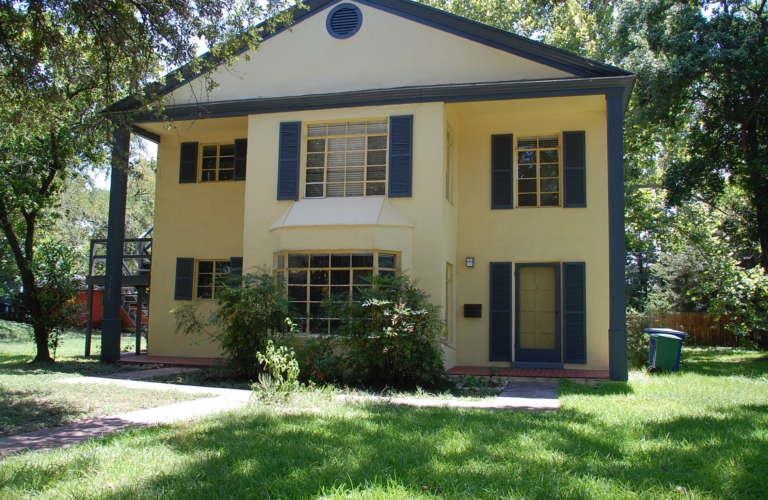 Rear view of house with stucco siding