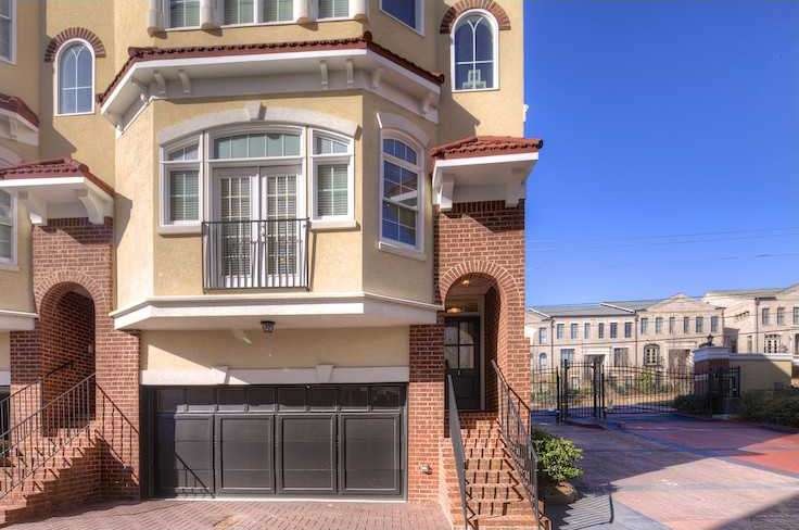 Exterior Front. Brick front and stucco with a two-