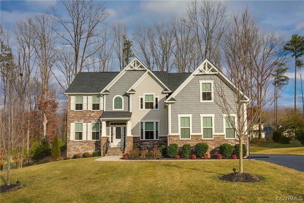 Craftsman-style home featuring a front lawn