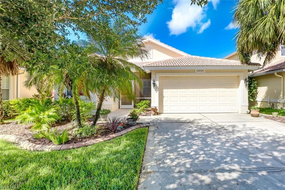 Welcoming Driveway with updated landscaping to gre