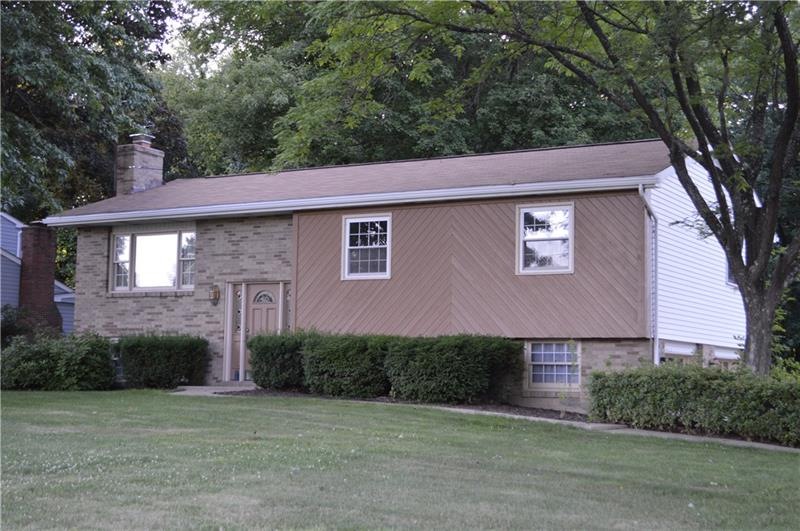 Warm Inviting. Surrounded by a large, level yard a