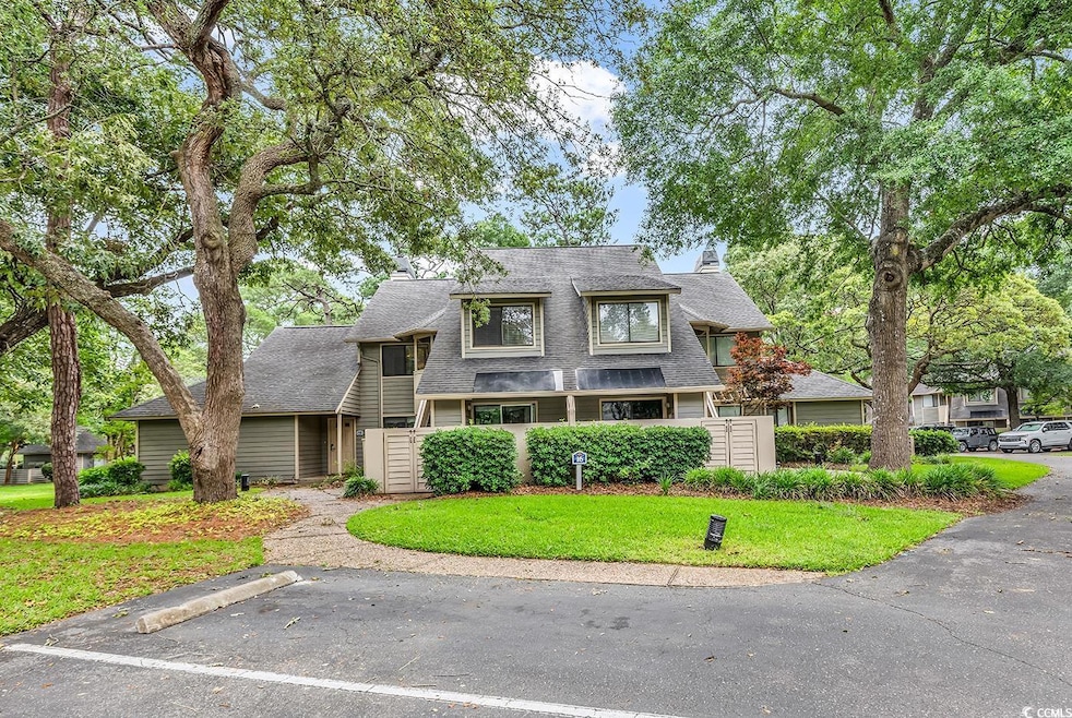 Shingle-style home with a shingled roof
