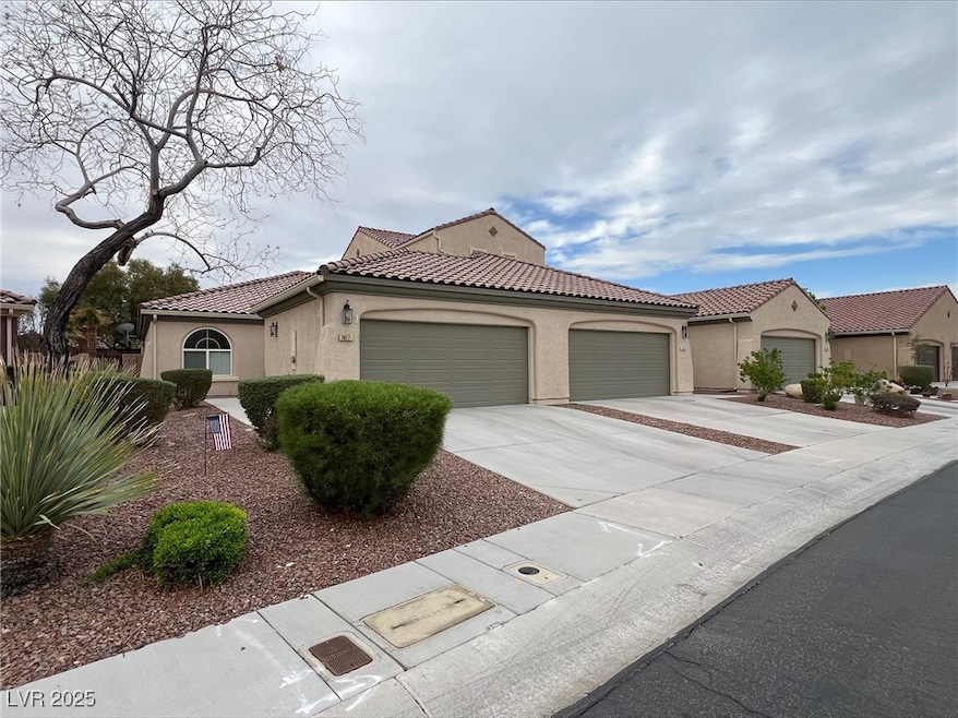 Mediterranean / spanish-style house featuring a ti