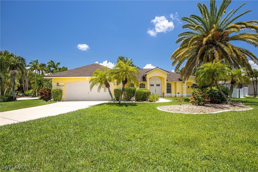 View of front of property with concrete driveway,