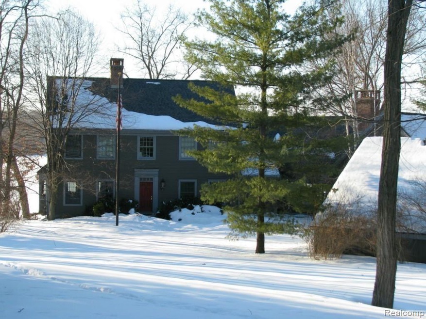 Front view of home from street, carriage home in f