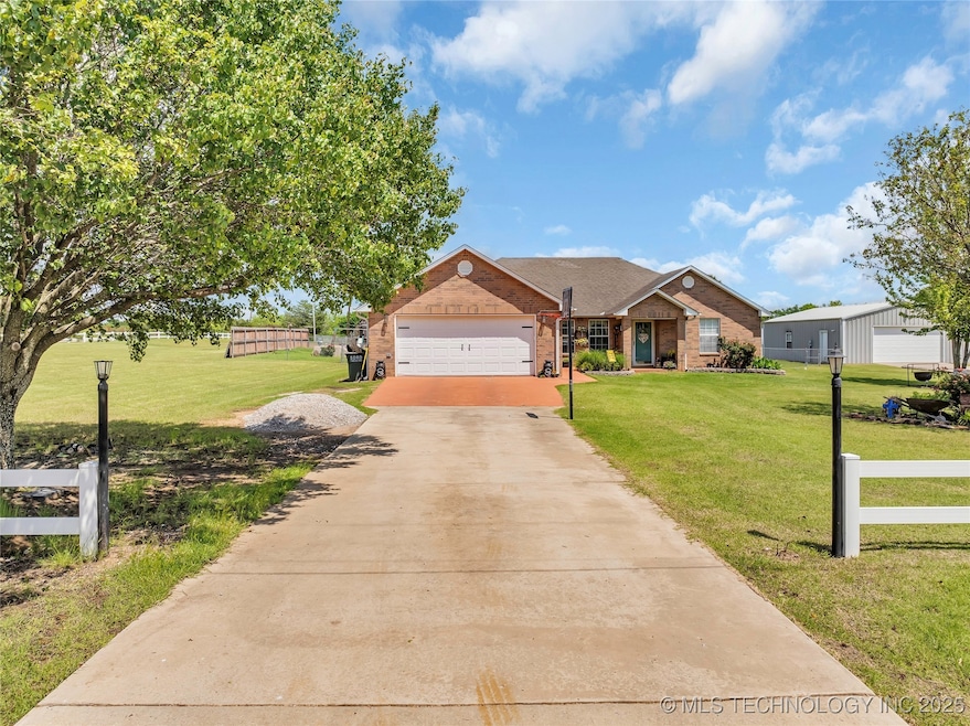 View of front of house featuring brick siding, an