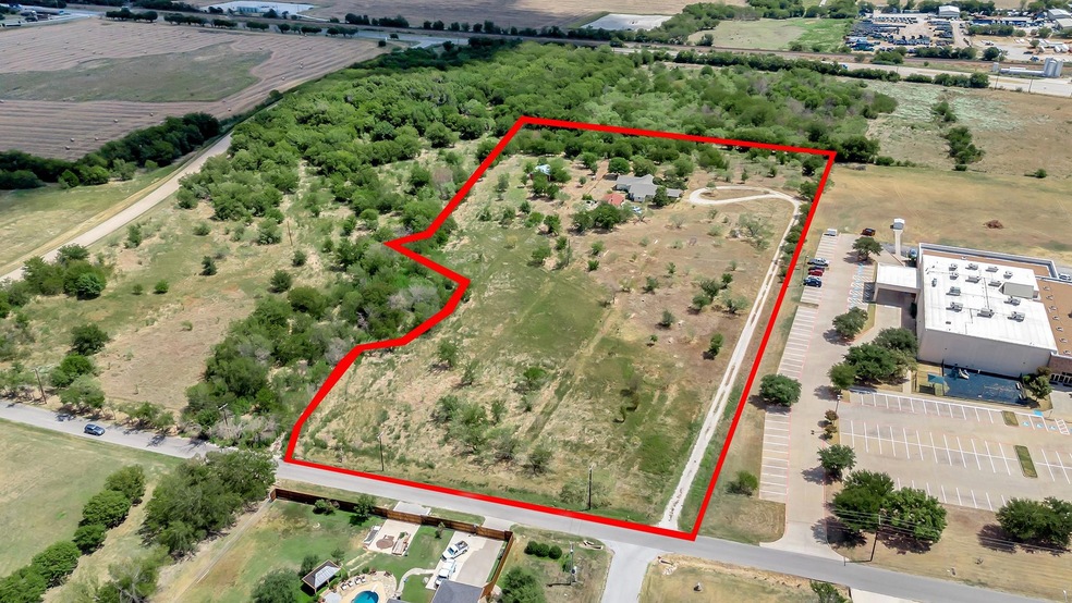 6.7 acres .5 miles from Justin Town Square.