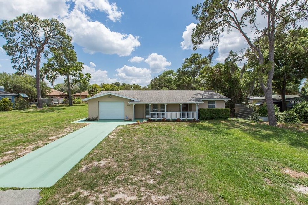 Front elevation... Extra long driveway