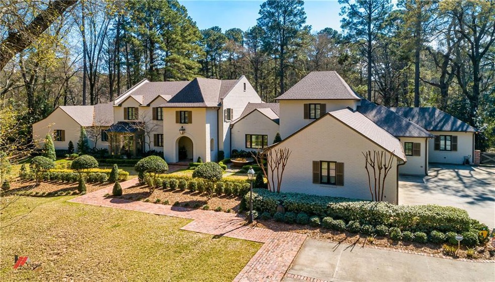 Stunning 3.5 acre estate located on private Lake F