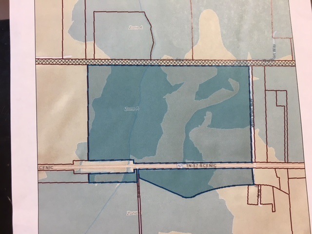 Darker blue is land in Flood Plain. Lighter blue i