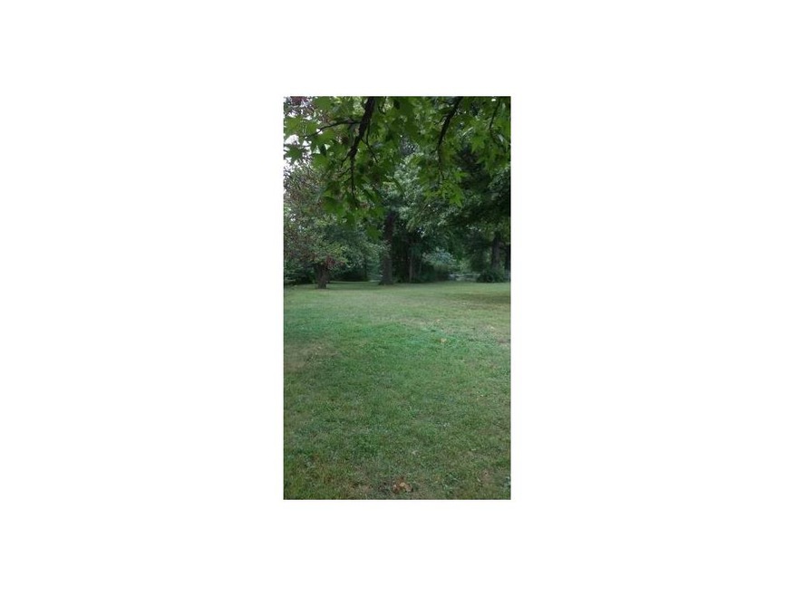 Beautifully treed 1/2 acre corner lot