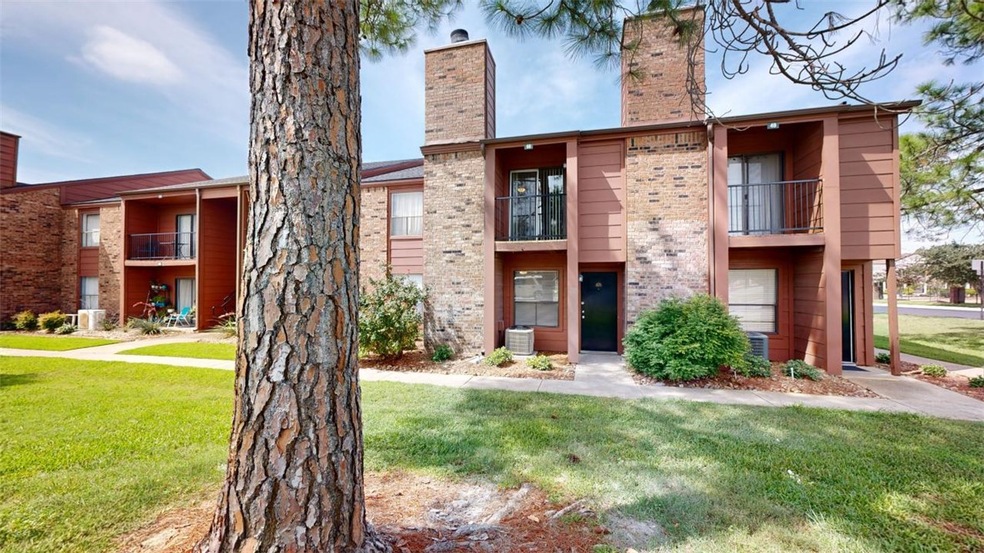 View of property with central AC unit