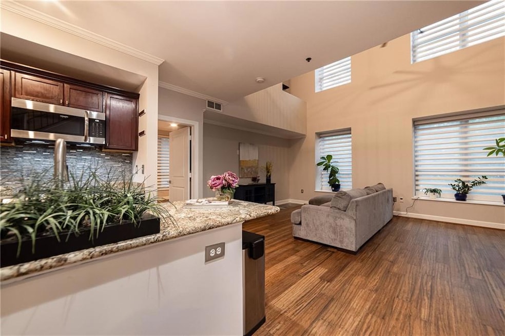 Kitchen featuring open floor plan, crown molding, 