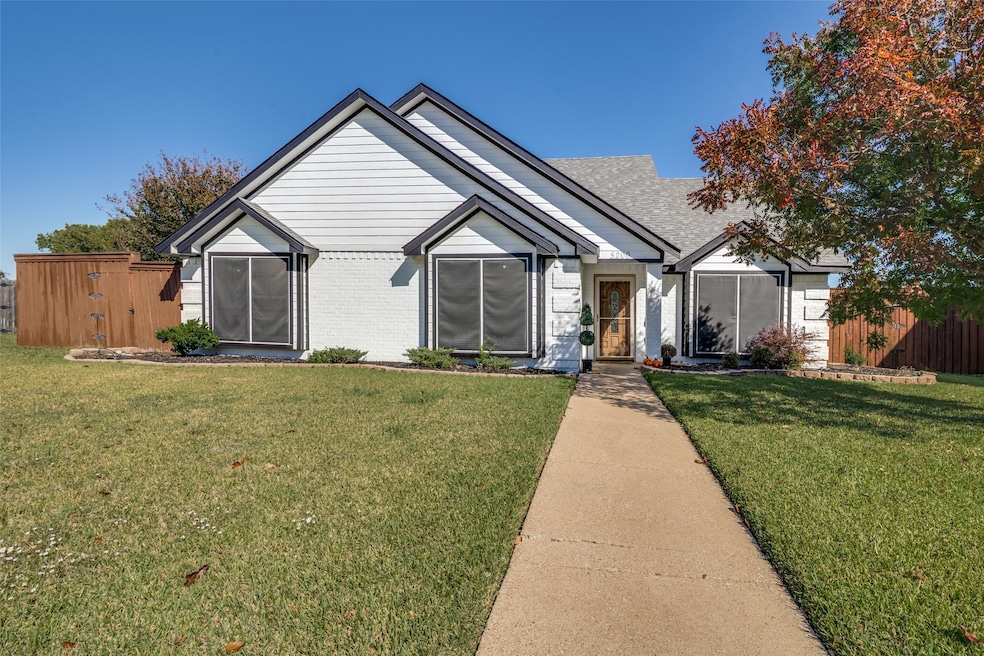 View of front of house with brick siding