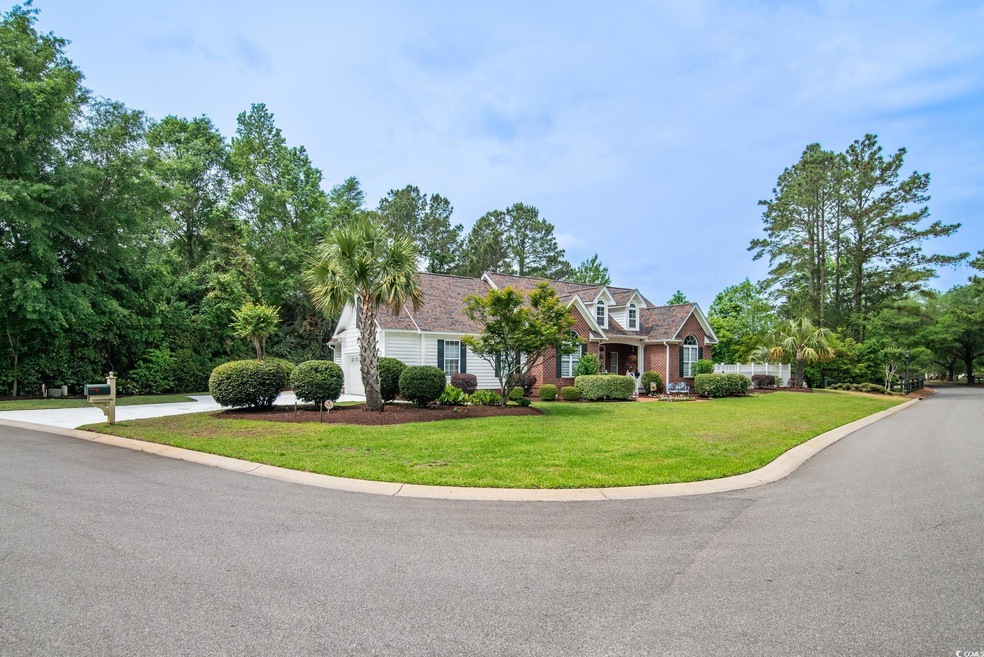 Cape cod home featuring a front lawn