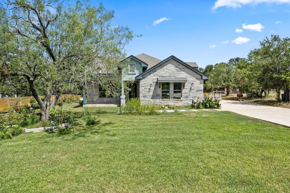 View of front of property featuring stone siding,