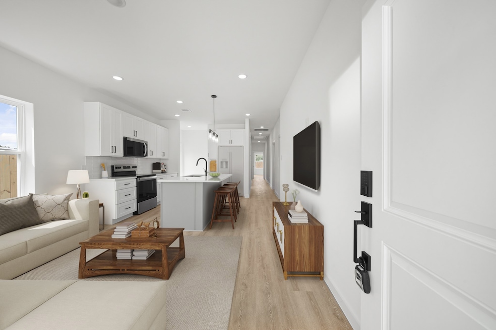 Virtually Staged: Step into your home, be mesmerized by the vinyl plank floors, and the open floor plan showcasing the living and kitchen areas.