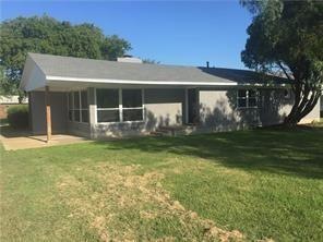 Back of house featuring a patio and a lawn