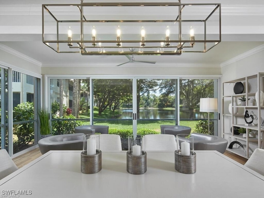 Sunroom / solarium featuring a water view and a no
