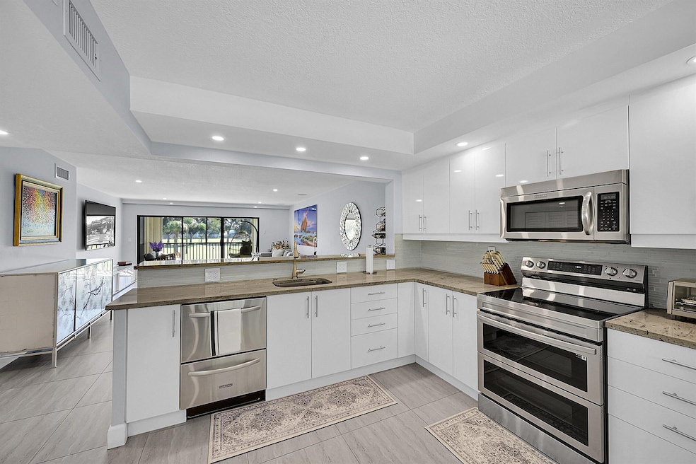 12870 Briarlake 201 Dr unit 201, Palm Beach Gardens, FL 33418 - photo 1