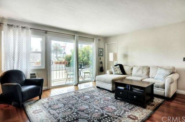 HUGE living room with floor to ceiling windows.  T