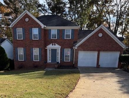 Beautiful traditional home with brick front on a landscaped culdesac lot.