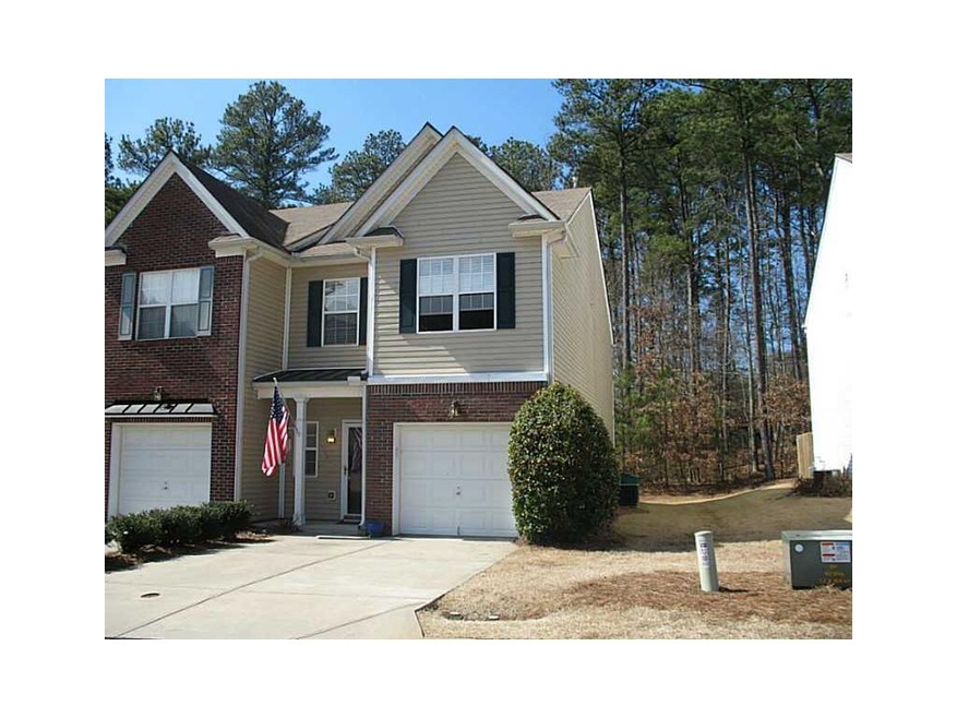 Exterior Front. End unit townhouse with one-car ga
