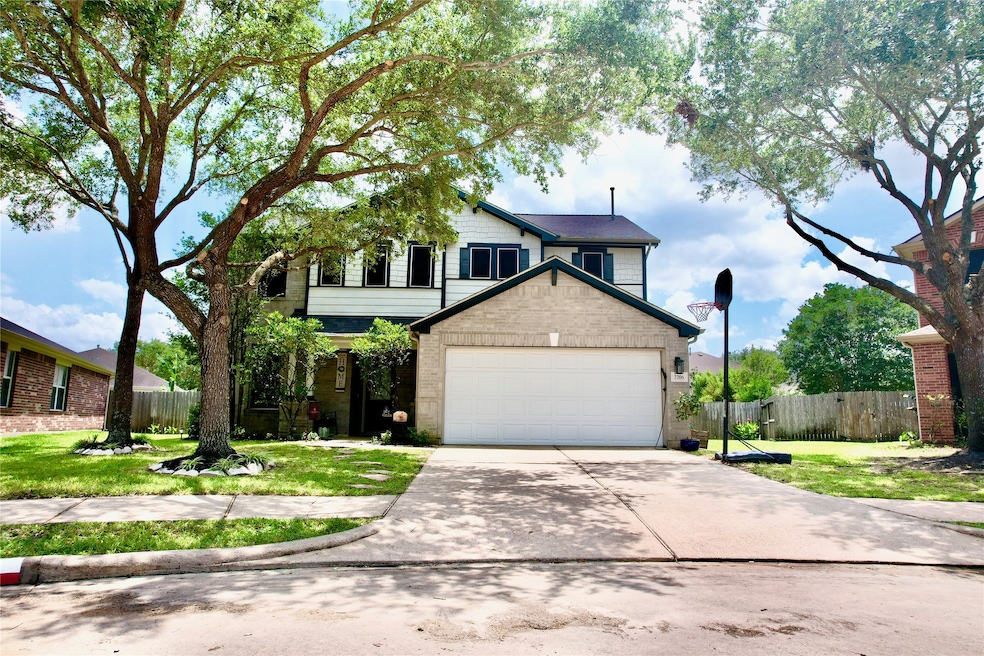 This inviting two-story home features a double gar