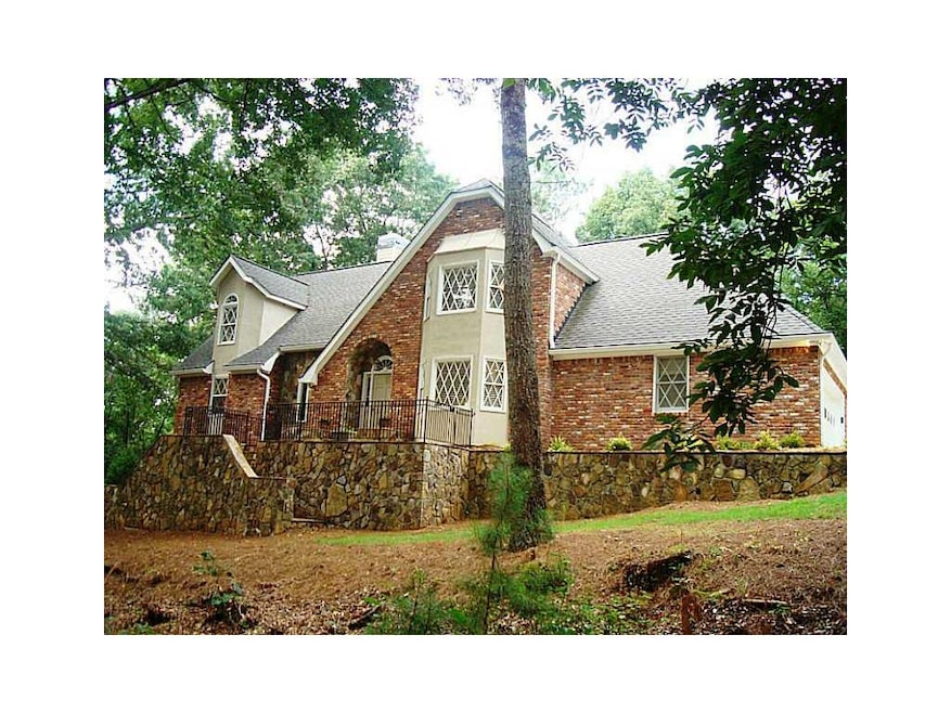 Exterior Front. Beautiful stone and brick home sit