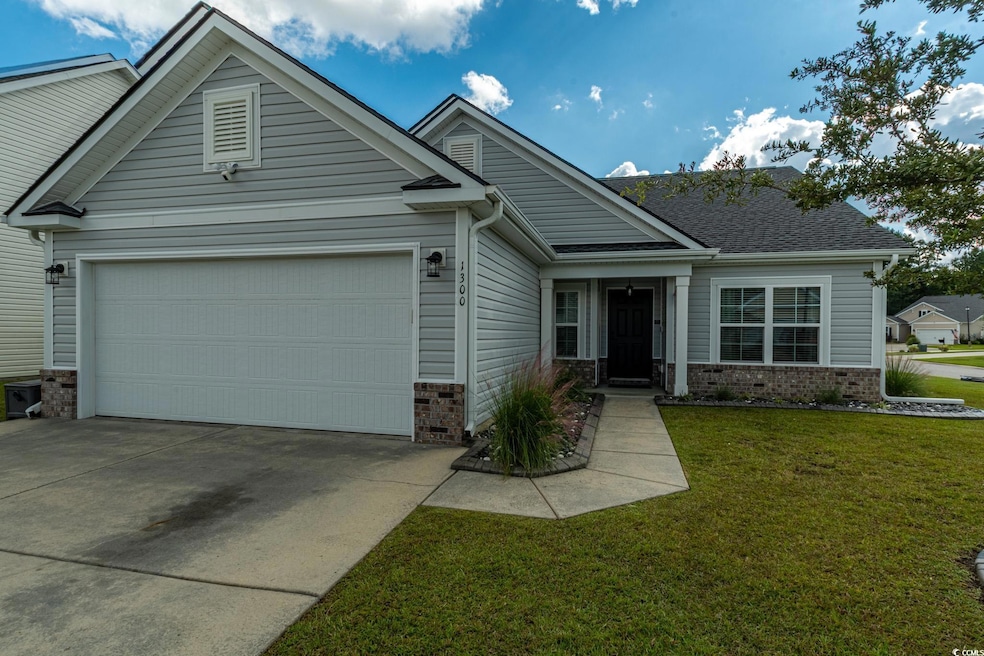 Craftsman house featuring a garage and a front yar