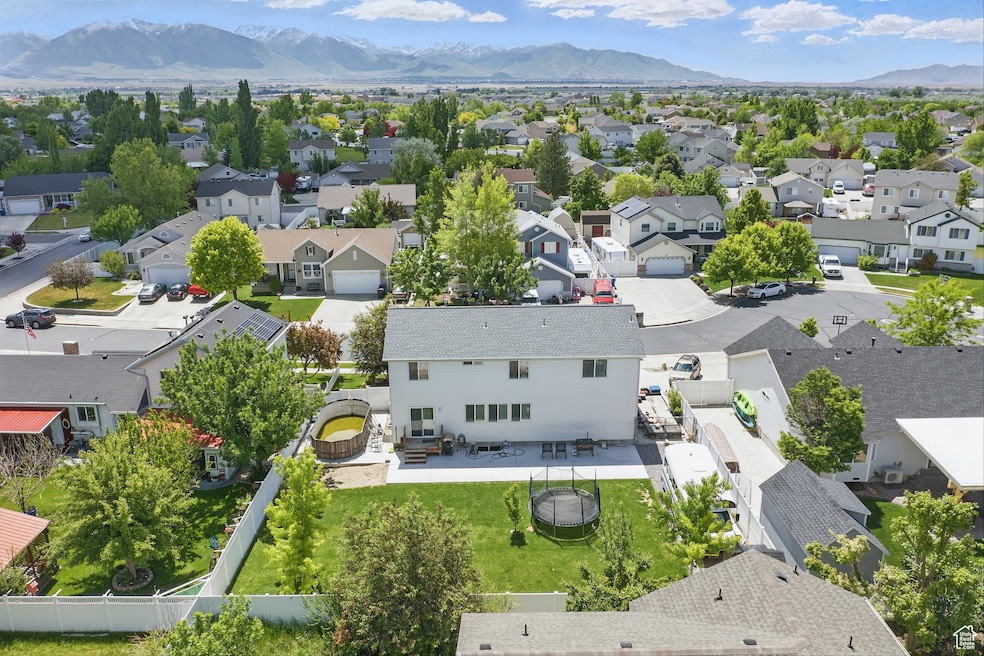 Aerial view of residential area featuring mountains