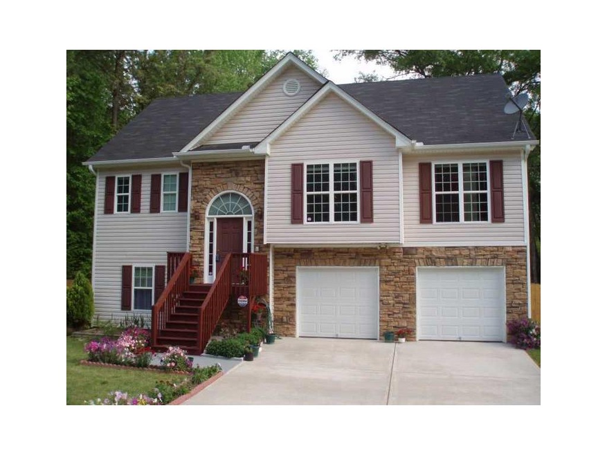 Exterior Front. Vinyl & Stone Construction