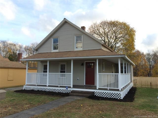 Front of home with new wrap around farmers porch.